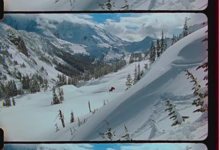 A person jumps off the mountain on skis