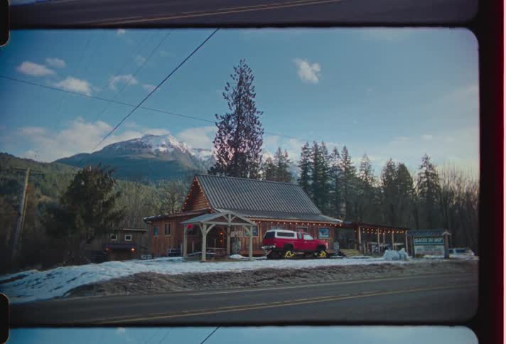 A roadside cabin in a snowcovered forest