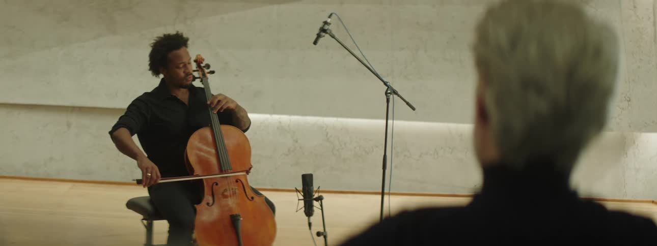 Talented musician plays cello for a single person audience