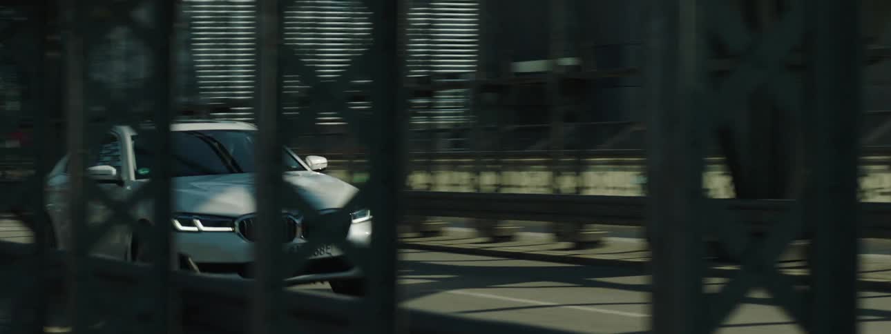 A car passing at high speed on the streets of an urban city
