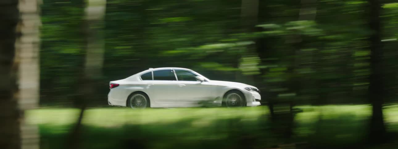 Motor vehicle speeding on the road during the day