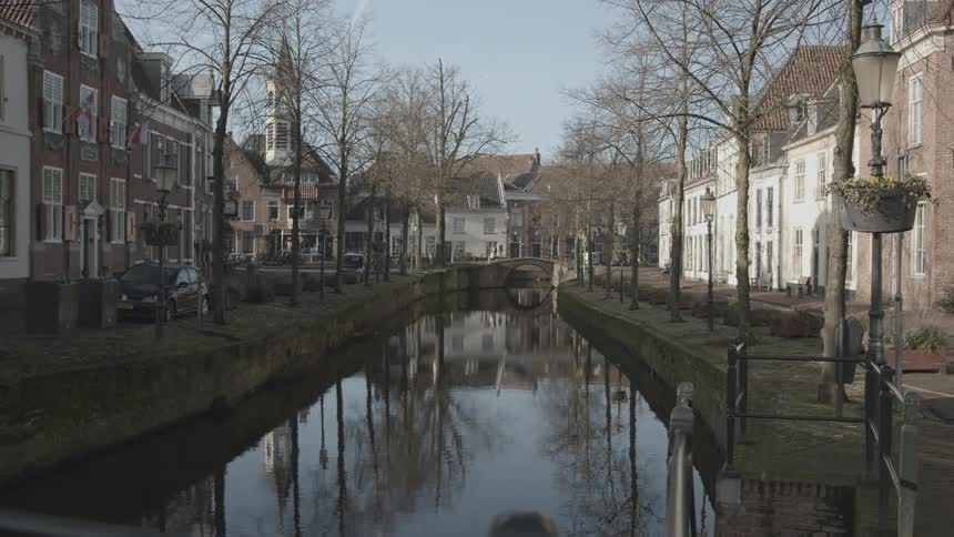 A waterway in a residential neighborhood on a cold morning