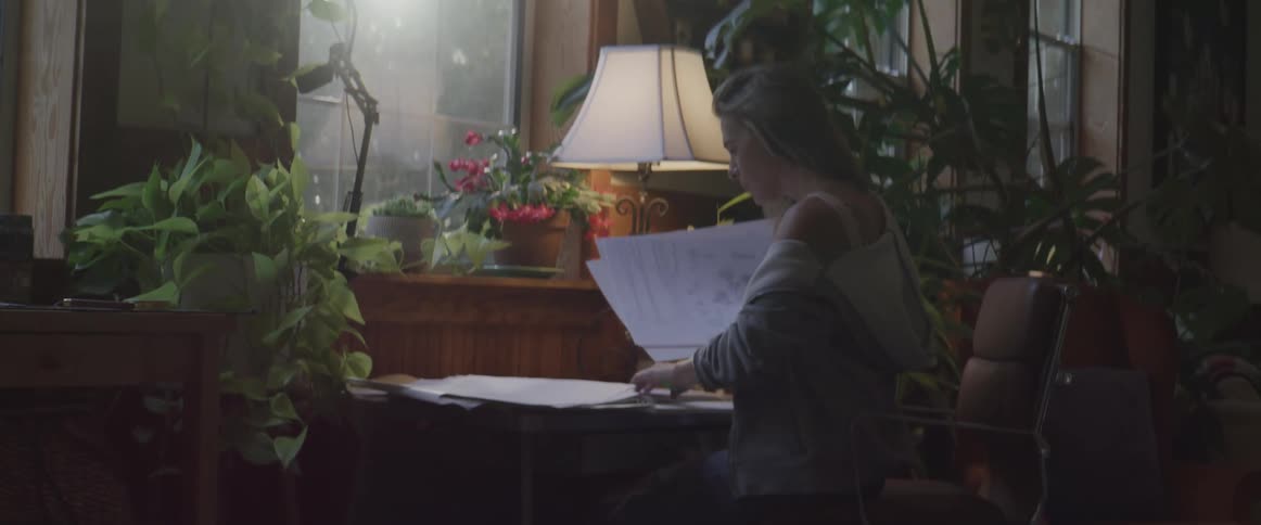 A clip of a lady going through some file