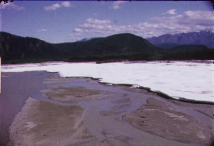 The water below is frozen around this shore
