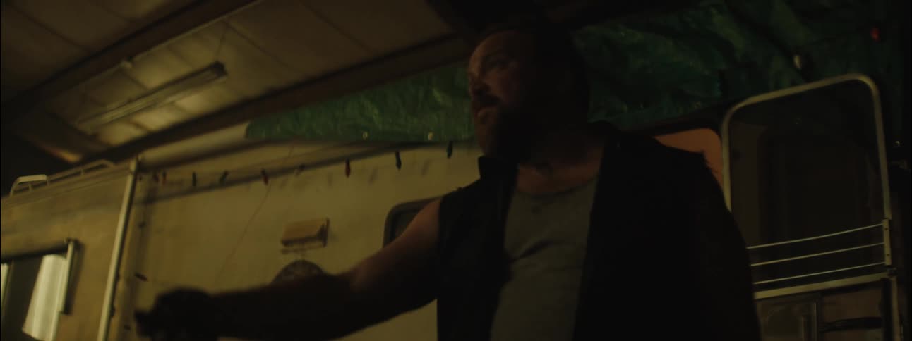Man coming out of his trailer and looking surprised