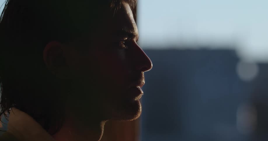 A close up clip of a male writing and imagining