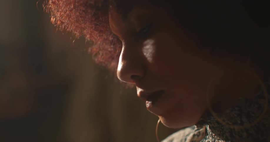 Portrait of a young woman with curly hair