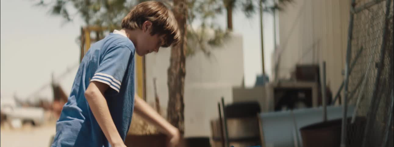 A clip of a boy parking his bicycle