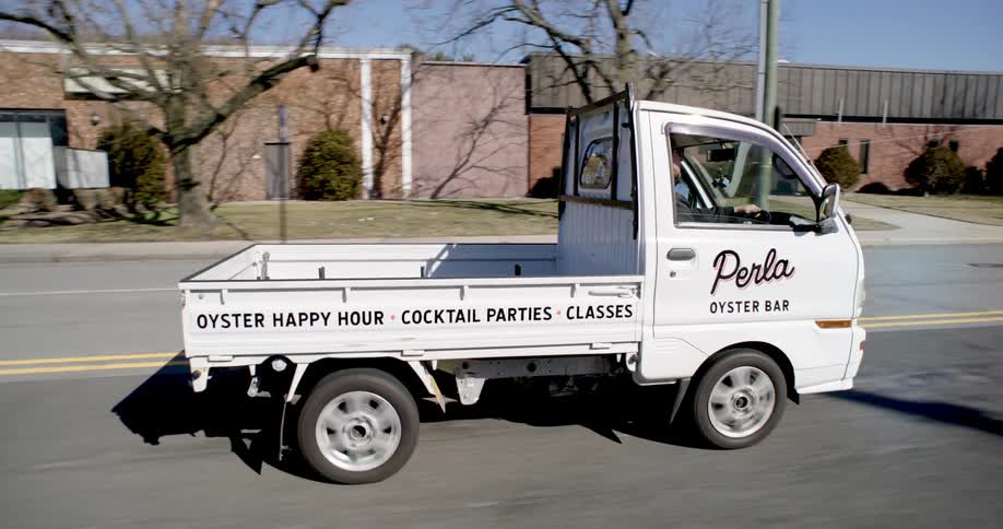A delivery truck drives down the road