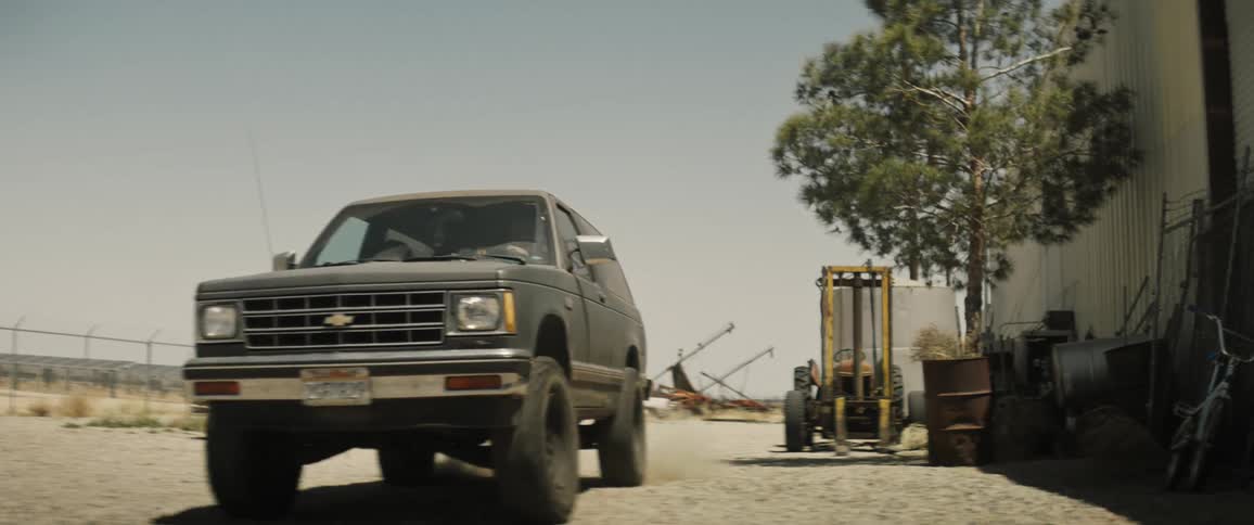 A clip of a parked vehicle driving off