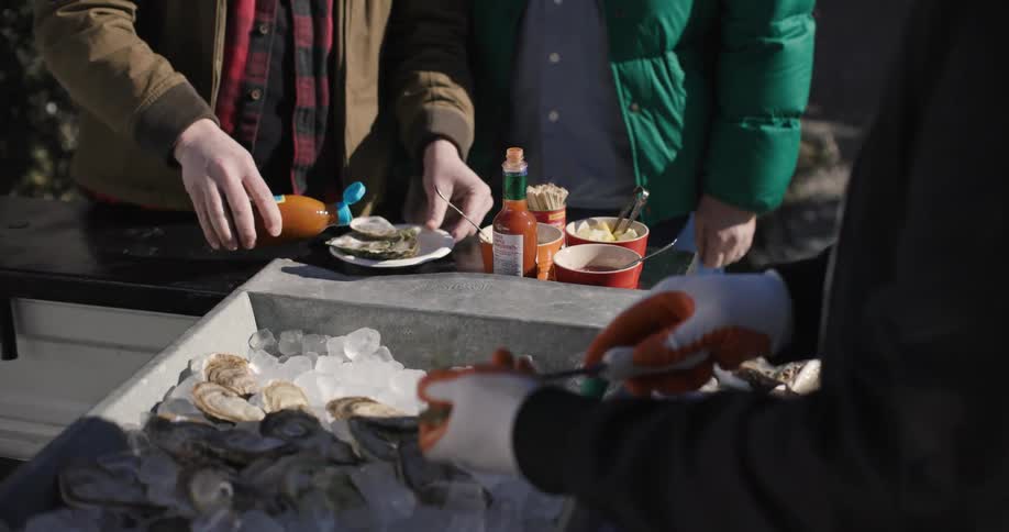 People eat seafood in an openair restaurant