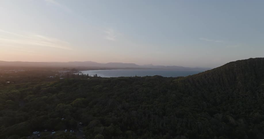 An aerial view showed a region with a dense forest and in the background a sea