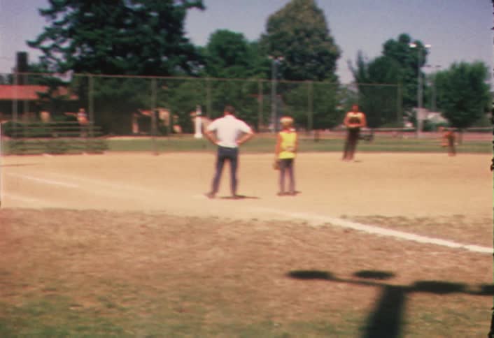 A group of kids practicing softball
