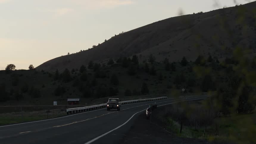 A truck drives down the highway