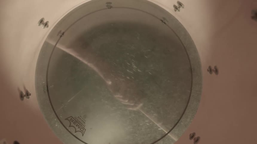 A person is playing the drums