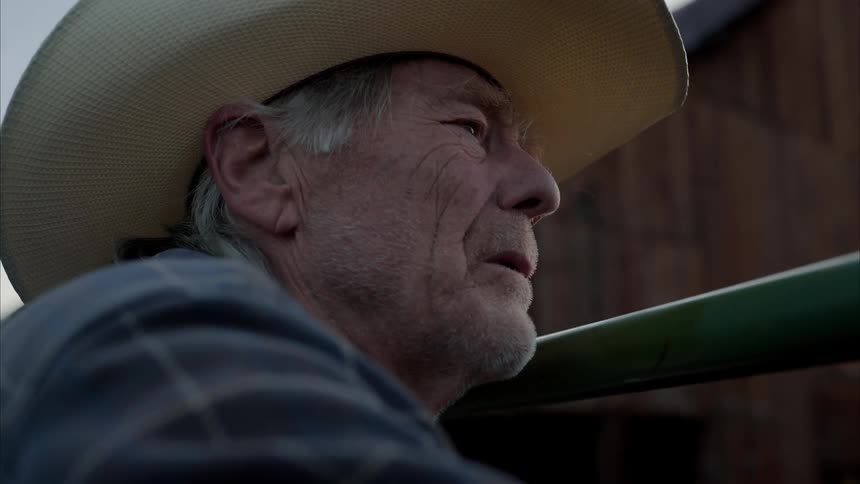 A clip of an old man on a cowboy hat