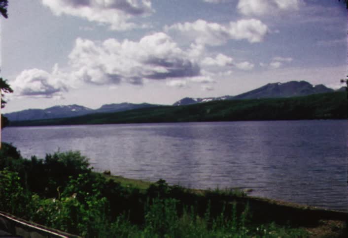 Panning view of a lake on a partly cloudy day
