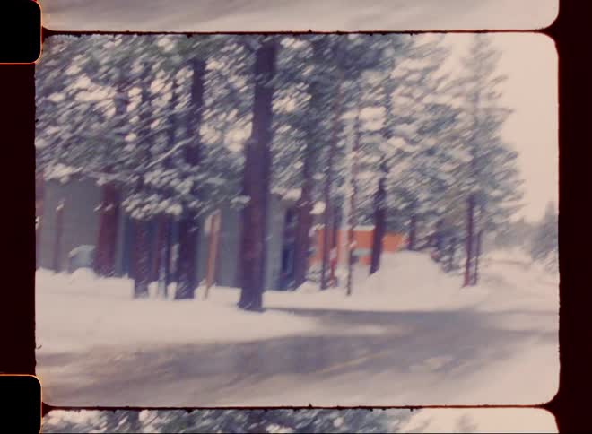 A car drives on the snowy road
