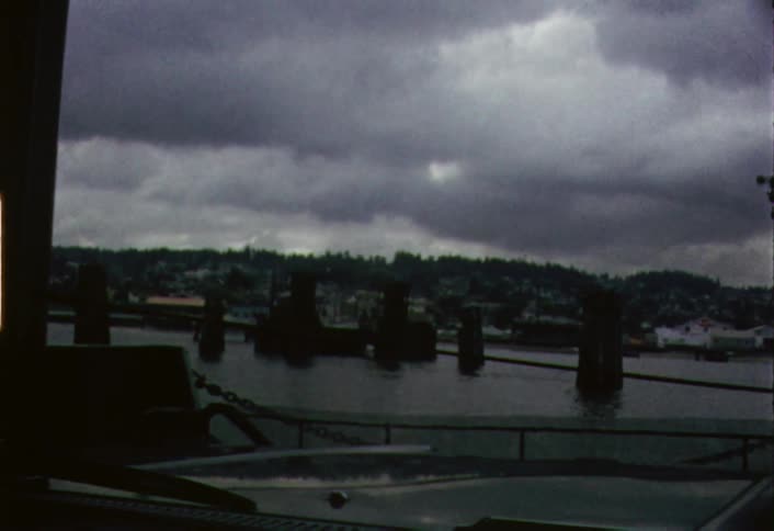 Posts and rope used as a barricade on a lake as seen from the windshield of a boat