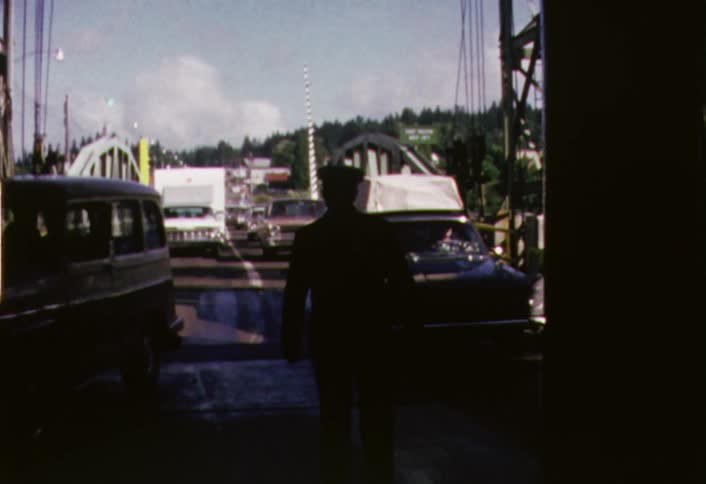 A man directing traffic on a bridge