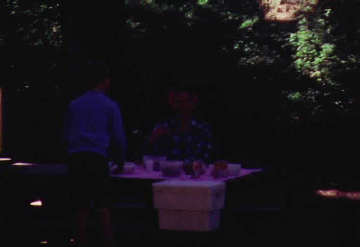A group of kids at a picnic table