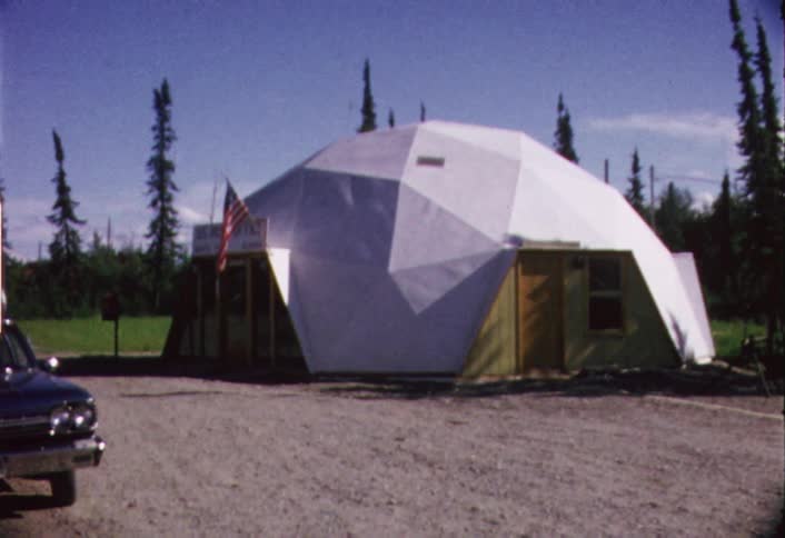 White domed structure with an american flag hanging from it
