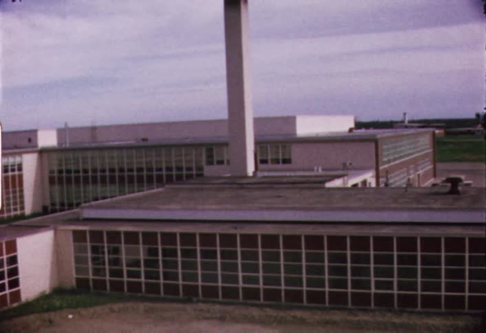 Panning view of a large school on a cloudy day