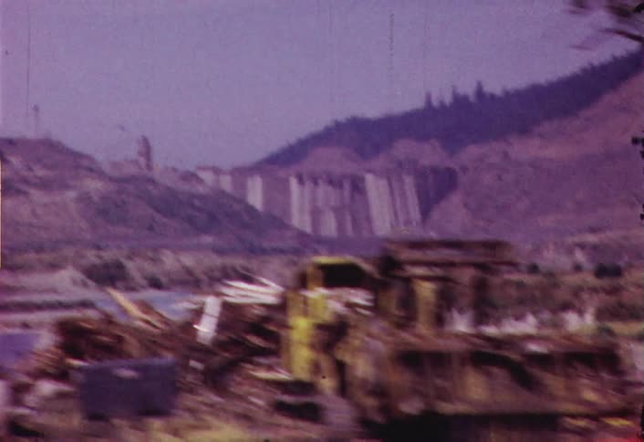 Moving fast past a work site by a body of water