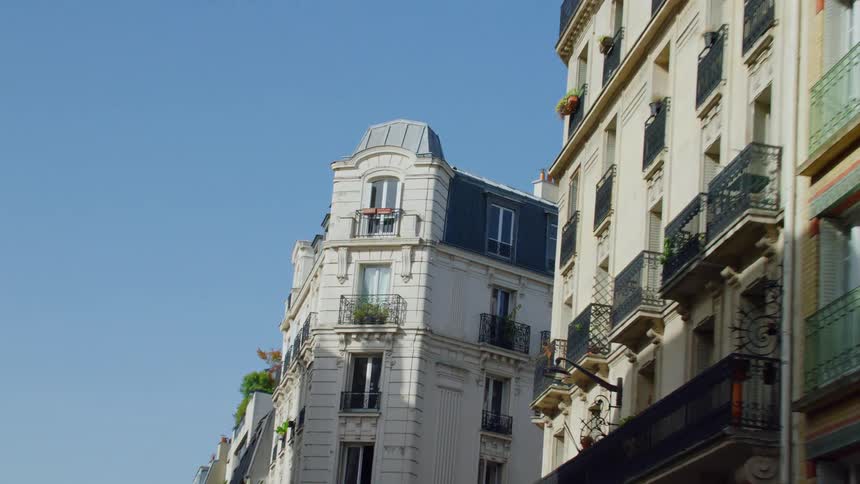 Daylight scene of a welllit elegant building facade in an european city