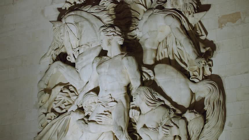 Architecture and arts at an arc de triomphe monument in france at night