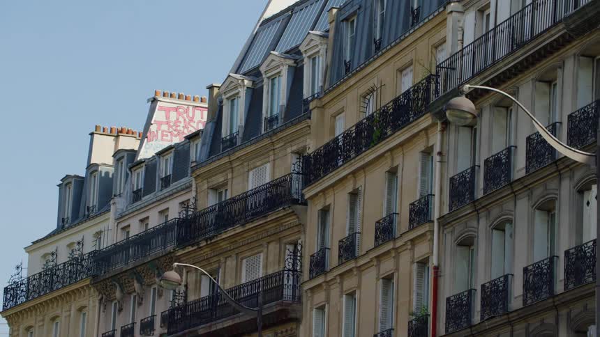Standardized buildings with balconies and residences on a morning