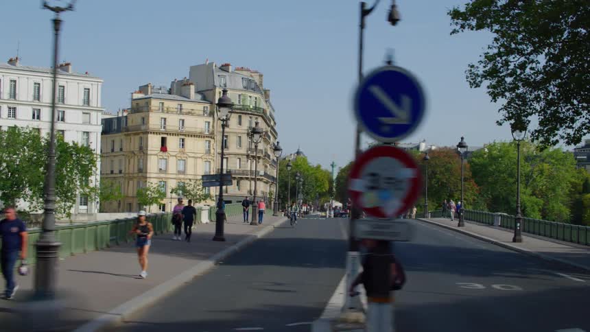 A wide street in a city with classic european architecture