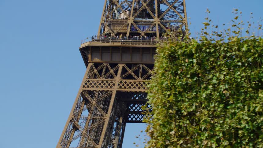 Crowd of people at eiffel tower on blue sky day
