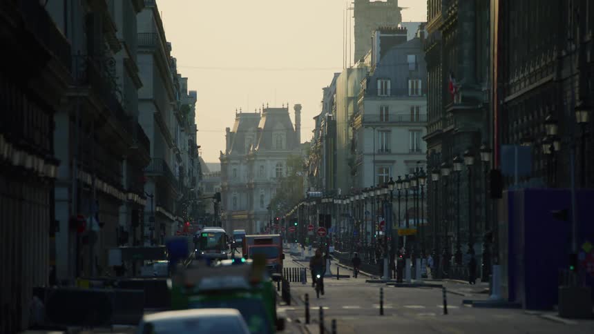 Panorama of an alley with residential buildings and vehicle and pedestrian traffic