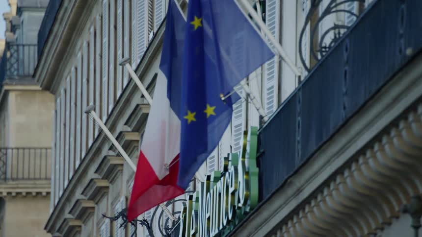 A clip of flags on a building