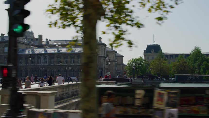 A bridge over a river in paris at daytime
