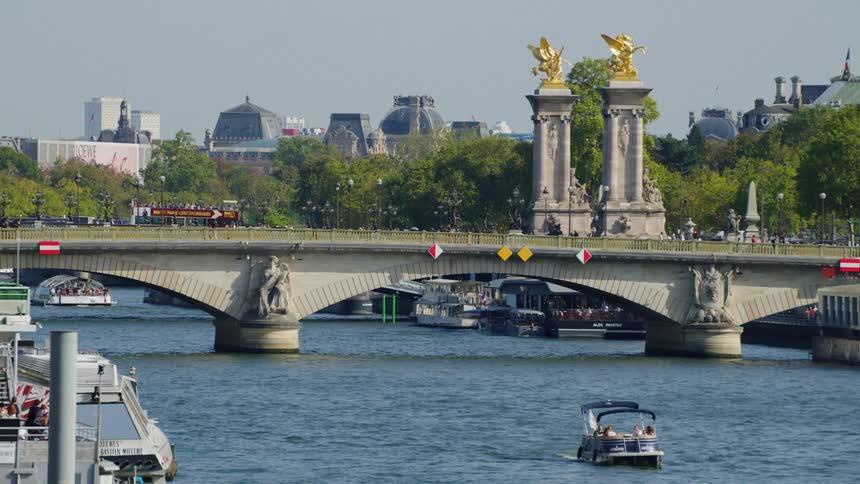 Landscape of a famous bridge on a canal over the sea with a monuments of golden angels