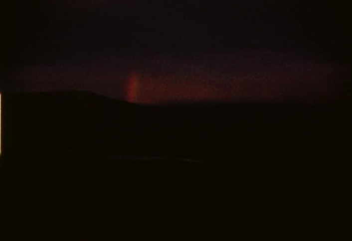 A dark area briefly has a small flash of light