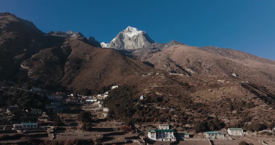 Landscape of a village under the mountains