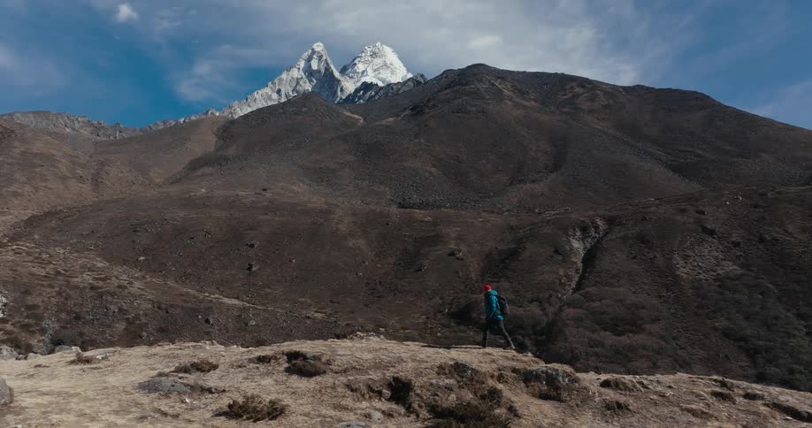 Aerial of a person hiking in the mountains on an adventure