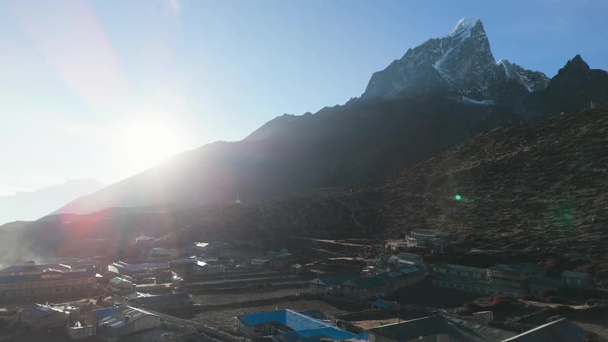 A small village in the mountains on a cold sunny day