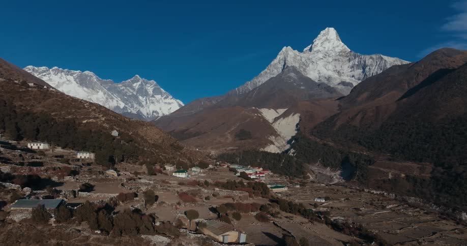 A village sits in a mountain valley