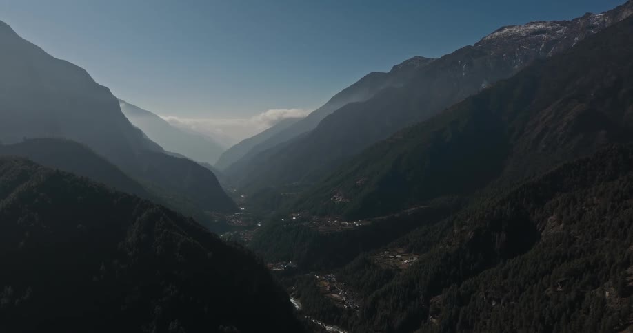Aerial landscape of rocky mountains with forests and villages