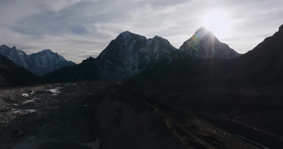 Aerial of a mountain valley with a river during sunset