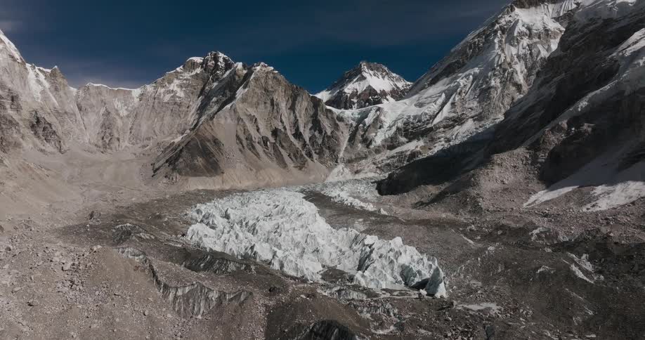 Snow and ice fills center of valley surrounded by mountains