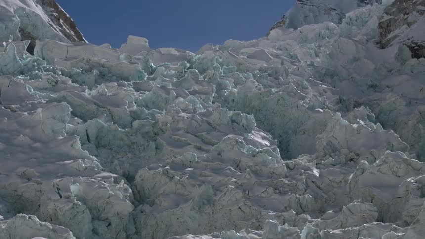 Rocky mountain covered with ice in snow
