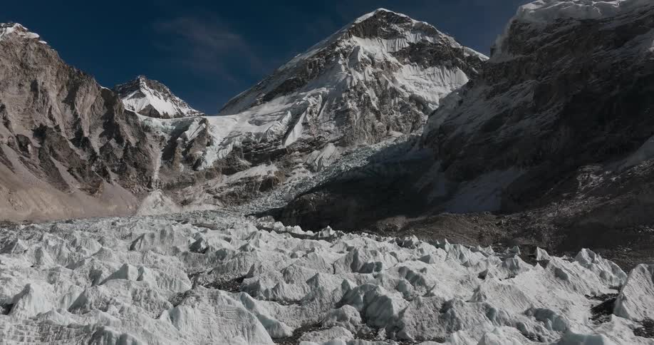 Ice formations covering a plateau at the foot of a mountain range