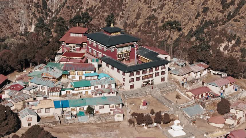 Village on a mountain plateau and surrounding cliffs