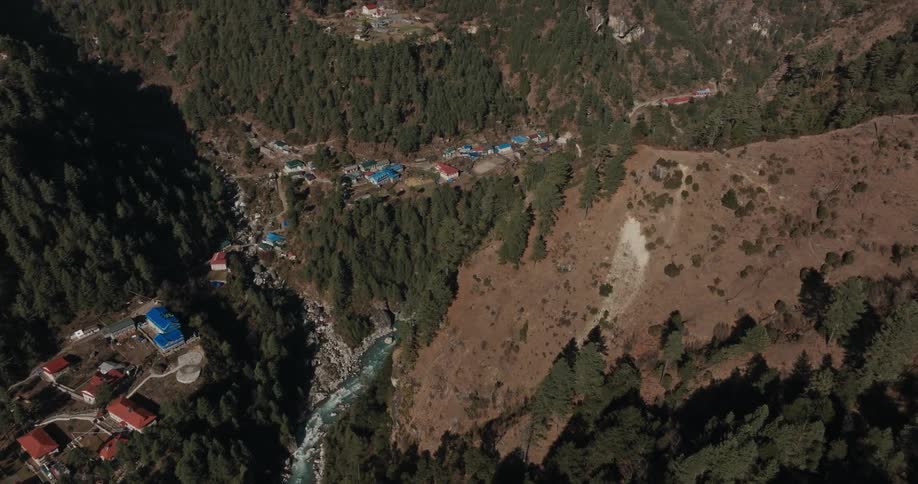 Village built in the middle of forested mountains