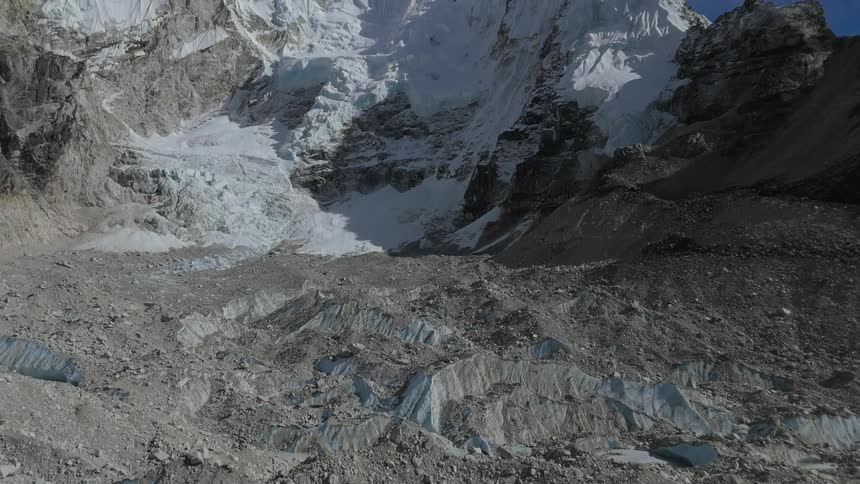 Rocky and geological ruins of a mountain covered in snow during the day